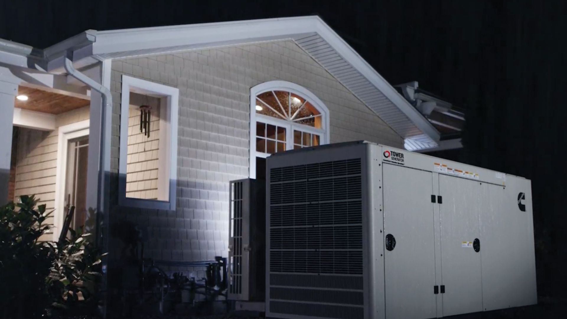 House illuminated up at night from a home generator