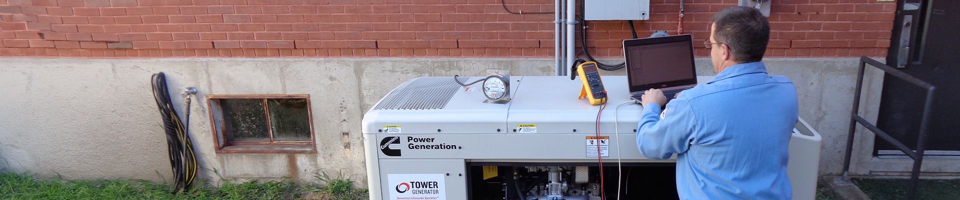 Tower Generator employee working on a generator