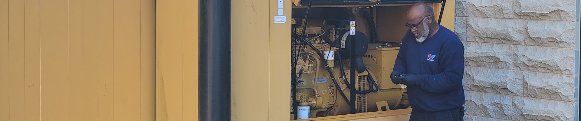 Tower Generator employee working on generator