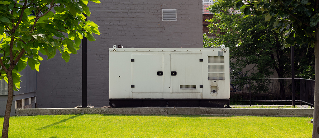 Standby generator outside of a school building.